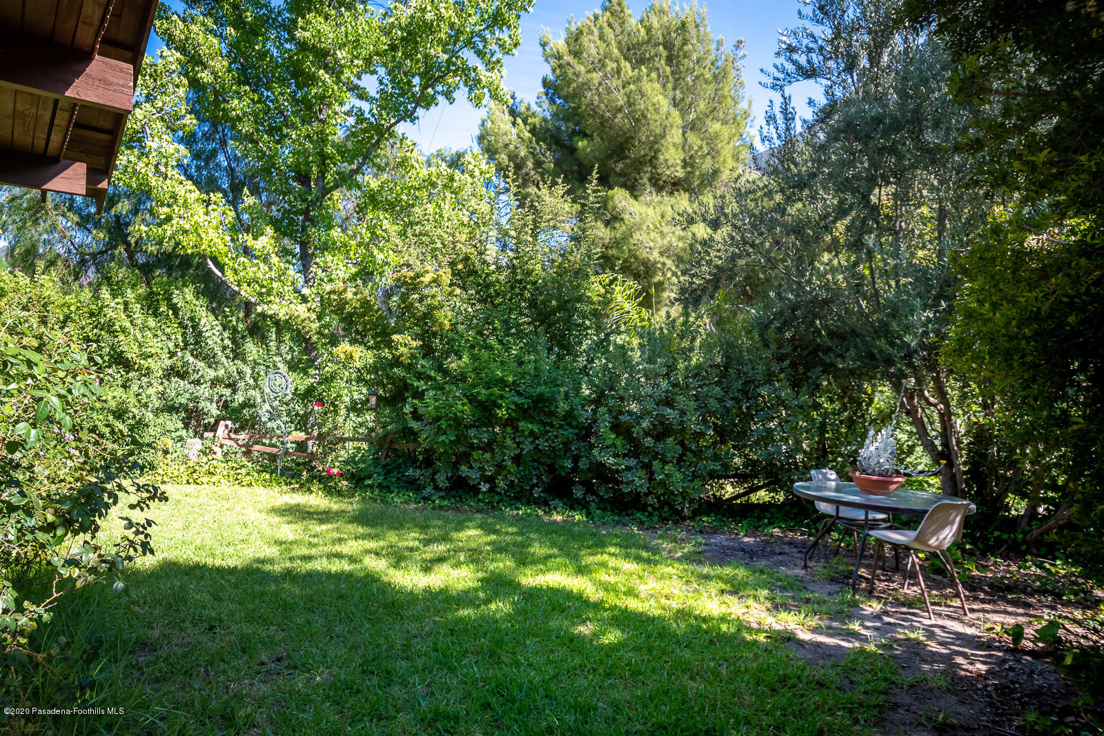 2311 Stonyvale Road Tujunga, CA 91042 - Photo 38 of 83 a backyard of a house with lots of green space and fountain