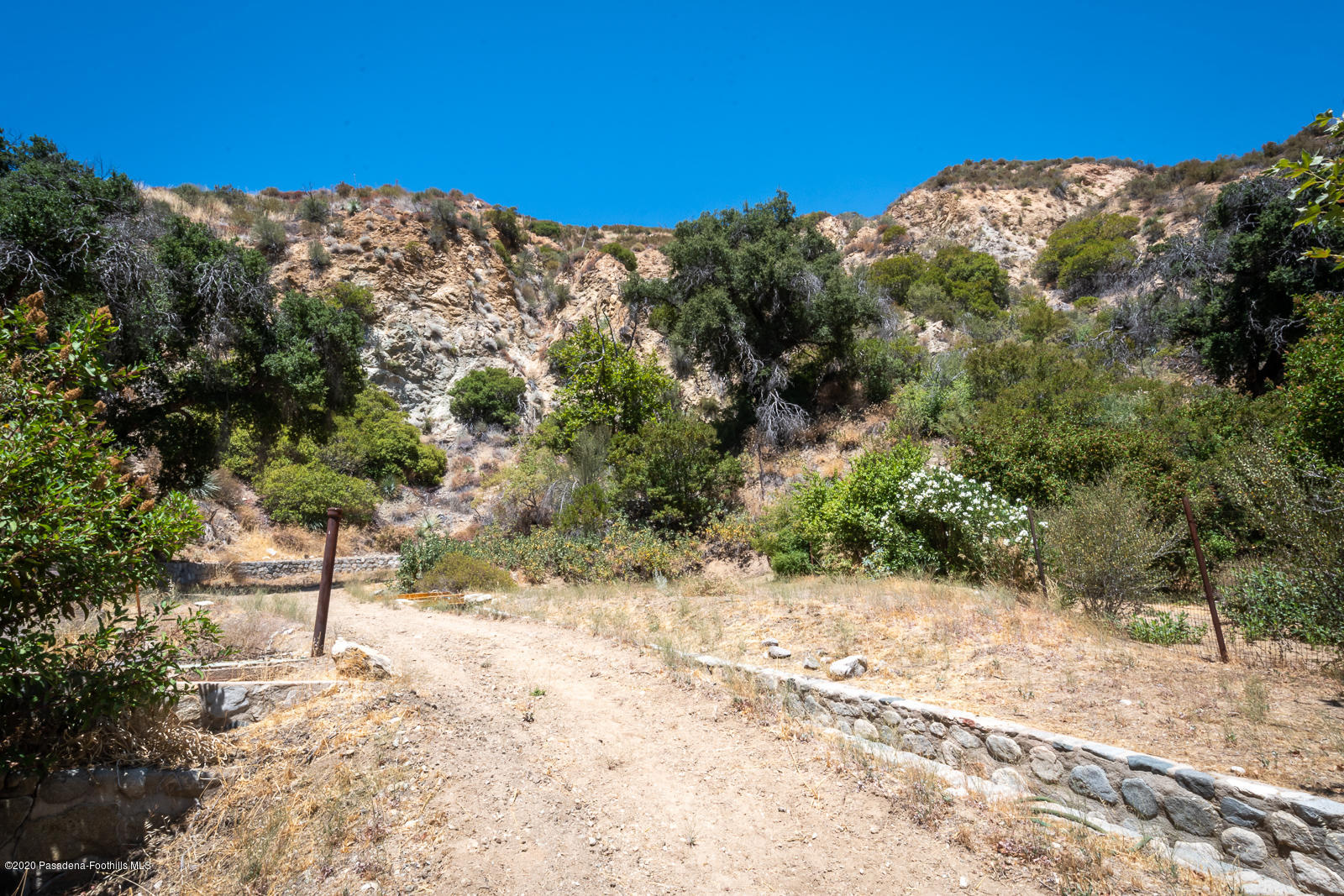 2311 Stonyvale Road Tujunga, CA 91042 - Photo 43 of 83 a view of a yard covered with snow in the background