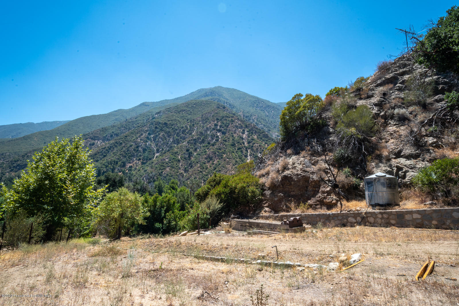 2311 Stonyvale Road Tujunga, CA 91042 - Photo 45 of 83 a view of a yard covered with snow in the background
