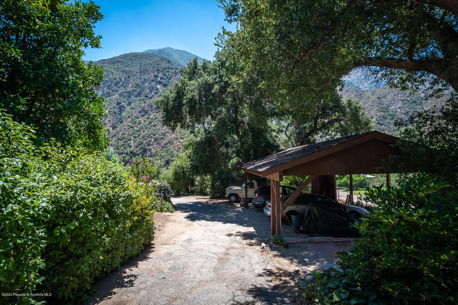 2311 Stonyvale Road Tujunga, CA 91042 - Photo 70 of 83 a view of backyard with a table and chairs under an umbrella