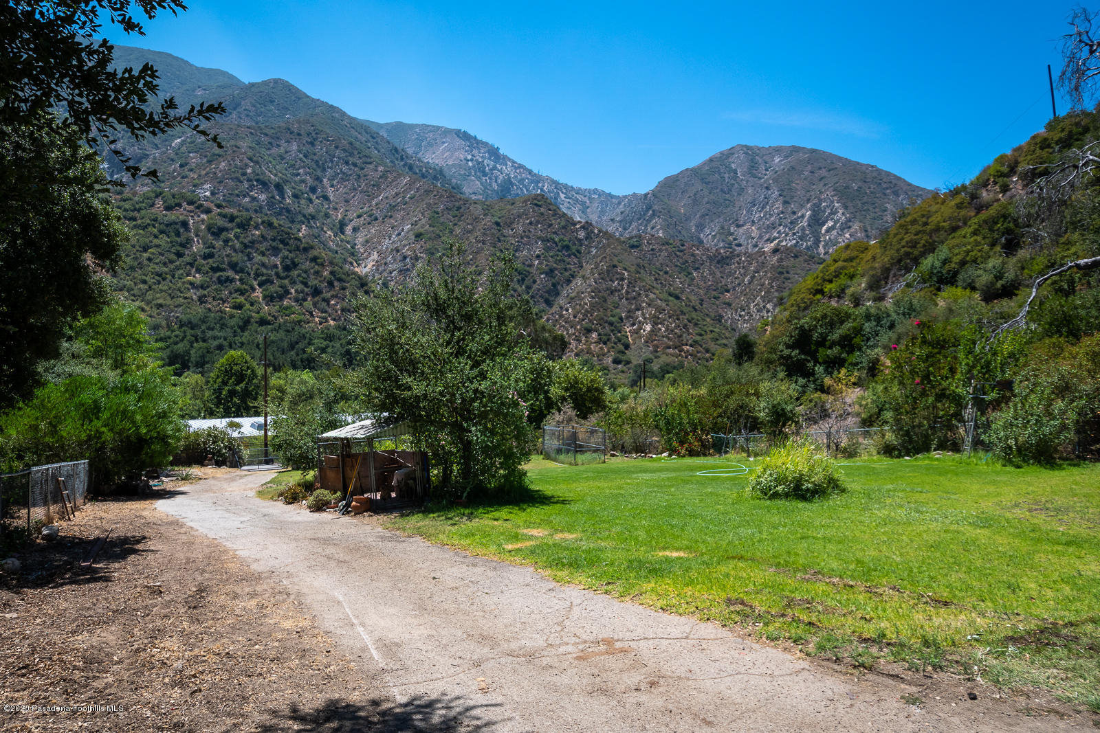2311 Stonyvale Road Tujunga, CA 91042 - Photo 73 of 83 a view of a grassy field with mountains in the background