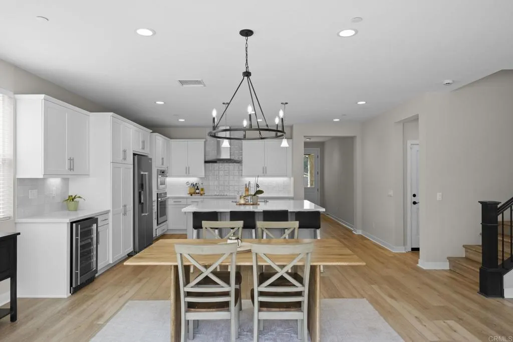3015 Rue De Latour Vista, CA 92084 - Photo 15 of 48 a dining table & chairs in a kitchen