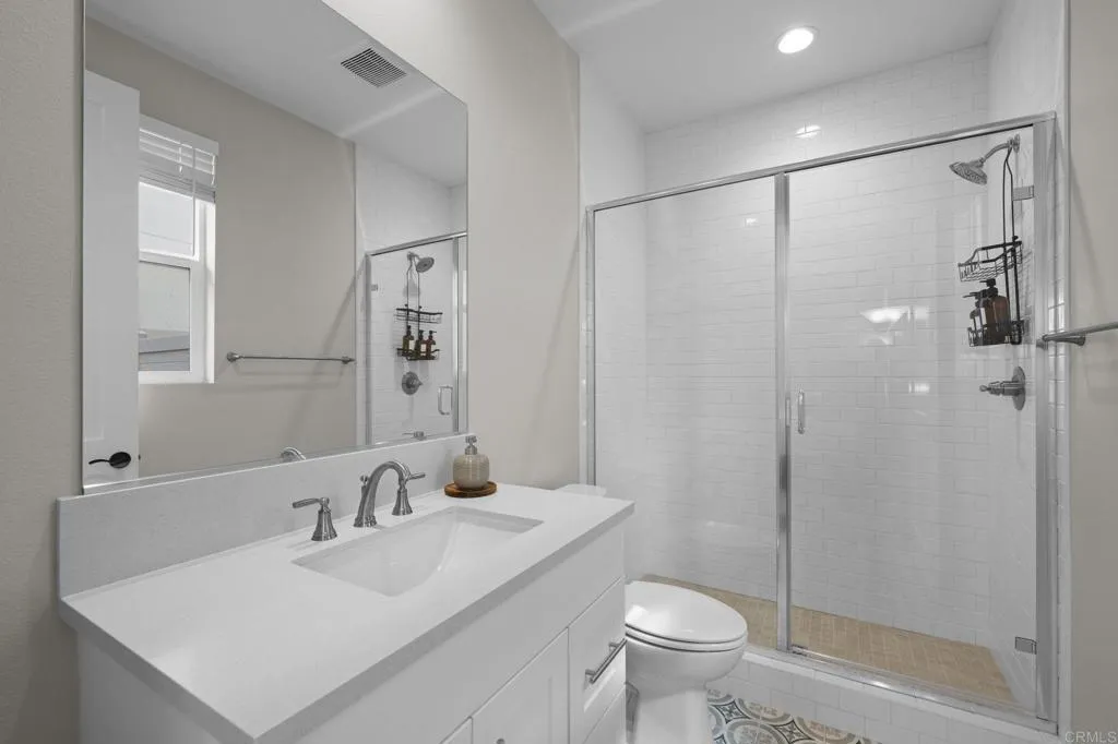 3015 Rue De Latour Vista, CA 92084 - Photo 20 of 48 a bathroom with a sink toilet and shower