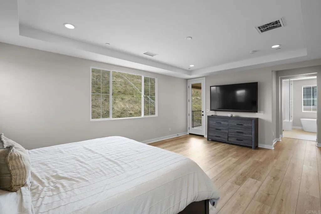3015 Rue De Latour Vista, CA 92084 - Photo 22 of 48 a bedroom with a bed and a flat screen tv