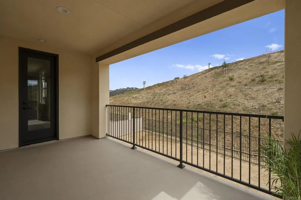 3015 Rue De Latour Vista, CA 92084 - Photo 26 of 48 a view of balcony with floor to ceiling window and stairs