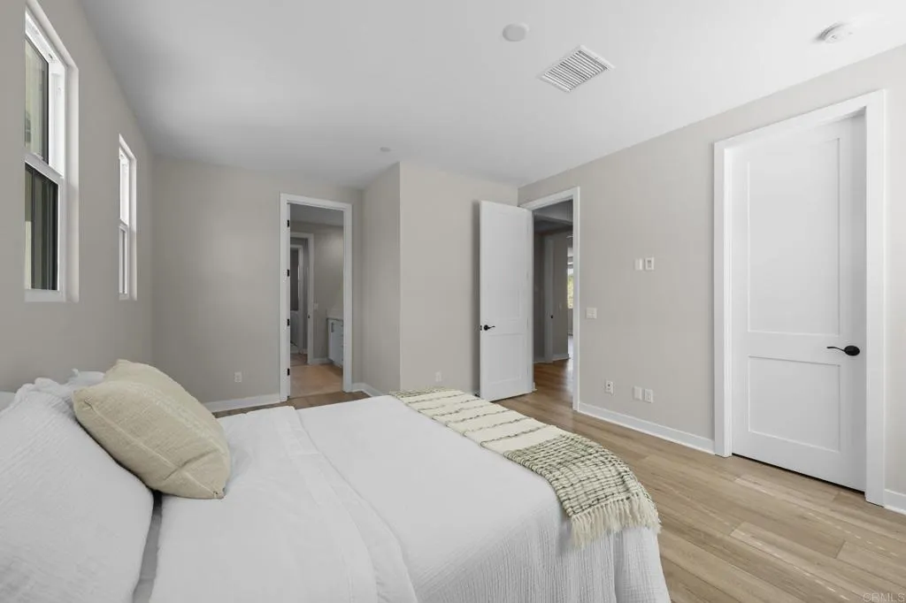 3015 Rue De Latour Vista, CA 92084 - Photo 29 of 48 a bedroom with a bed and a mirror