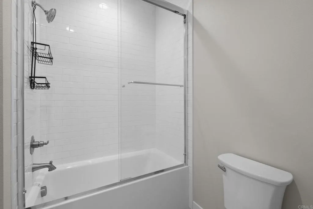 3015 Rue De Latour Vista, CA 92084 - Photo 32 of 48 a bathroom with a bathtub and a toilet