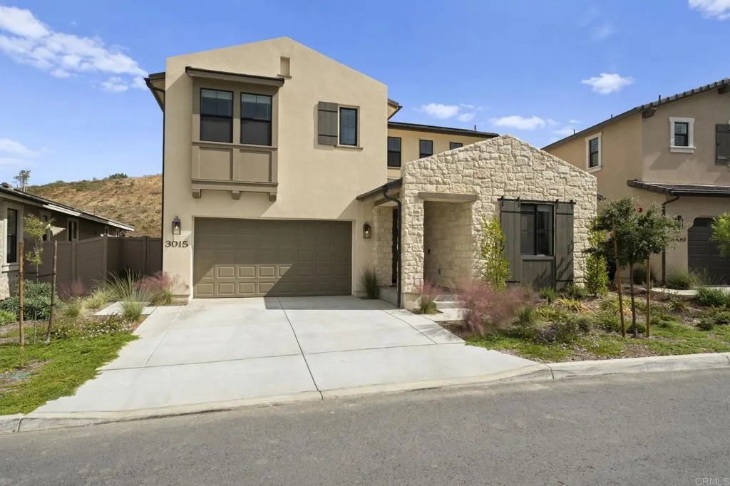 3015 Rue De Latour Vista, CA 92084 - Photo 39 of 48 a front view of a house with garden