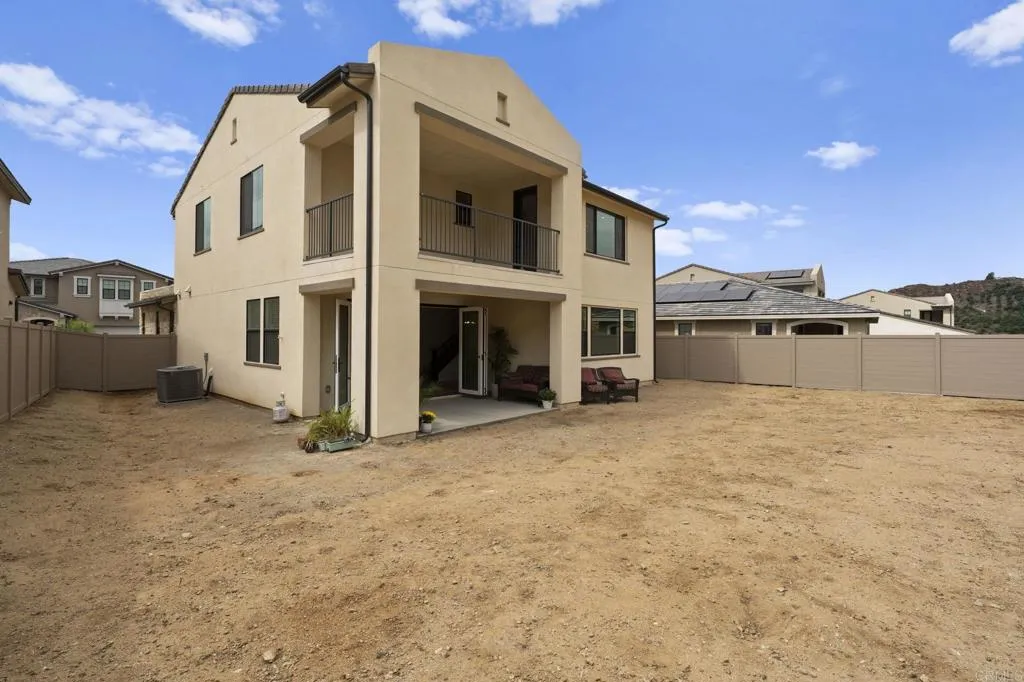 3015 Rue De Latour Vista, CA 92084 - Photo 41 of 48 a large white house with a large outdoor space