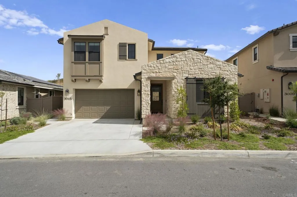 3015 Rue De Latour Vista, CA 92084 - Photo 45 of 48 a front view of a house with a yard and garage
