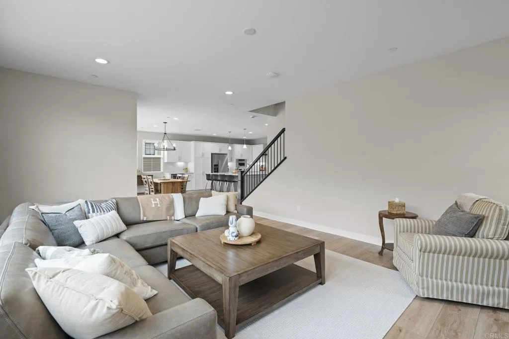 3015 Rue De Latour Vista, CA 92084 - Photo 5 of 48 a living room with furniture and a dining table