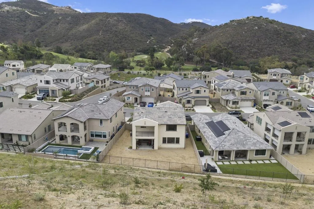 3015 Rue De Latour Vista, CA 92084 - Photo 6 of 48 a view of a house with a mountain in the background