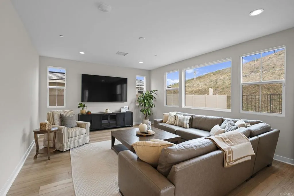 3015 Rue De Latour Vista, CA 92084 - Photo 8 of 48 a living room with furniture and a flat screen tv