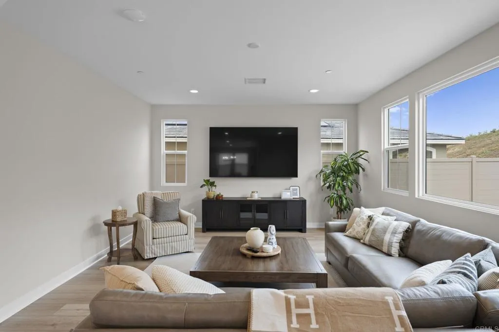 3015 Rue De Latour Vista, CA 92084 - Photo 9 of 48 a living room with furniture and a flat screen tv