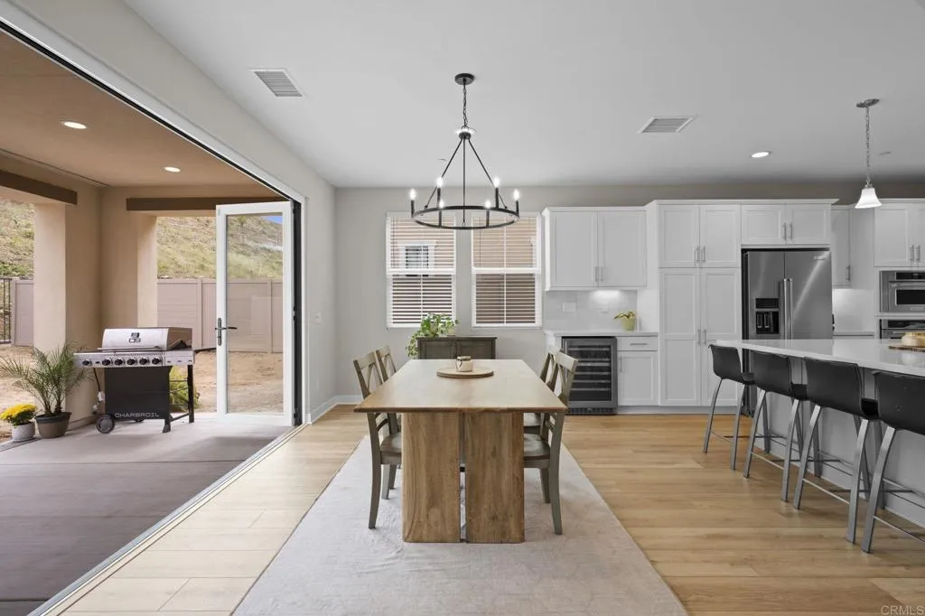 3015 Rue De Latour Vista, CA 92084 - Photo 10 of 48 a view of a dining room with furniture window and outside view