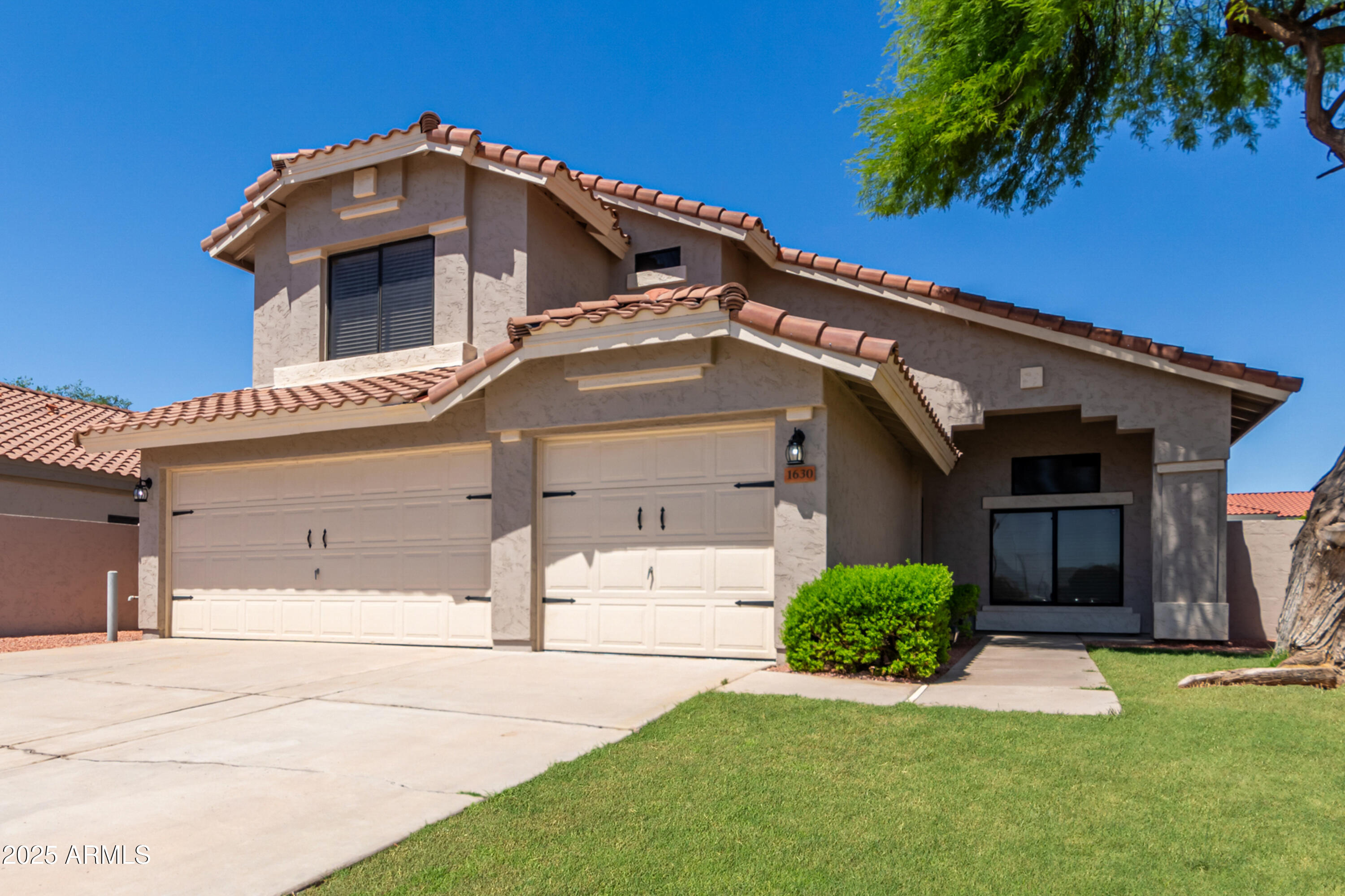 1630 South Lemon Mesa, AZ 85206 - Photo 14 of 55 a front view of a house with a yard