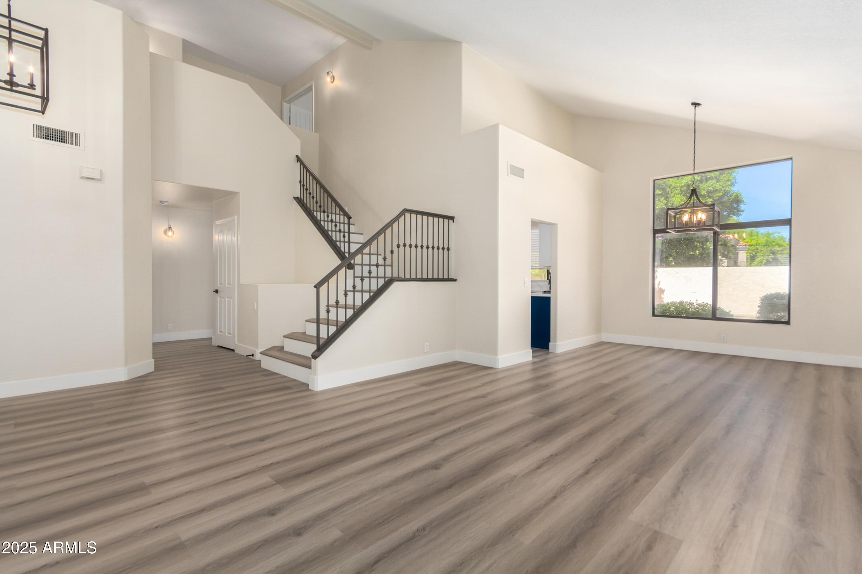1630 South Lemon Mesa, AZ 85206 - Photo 21 of 55 a view of empty room with wooden floor and fan