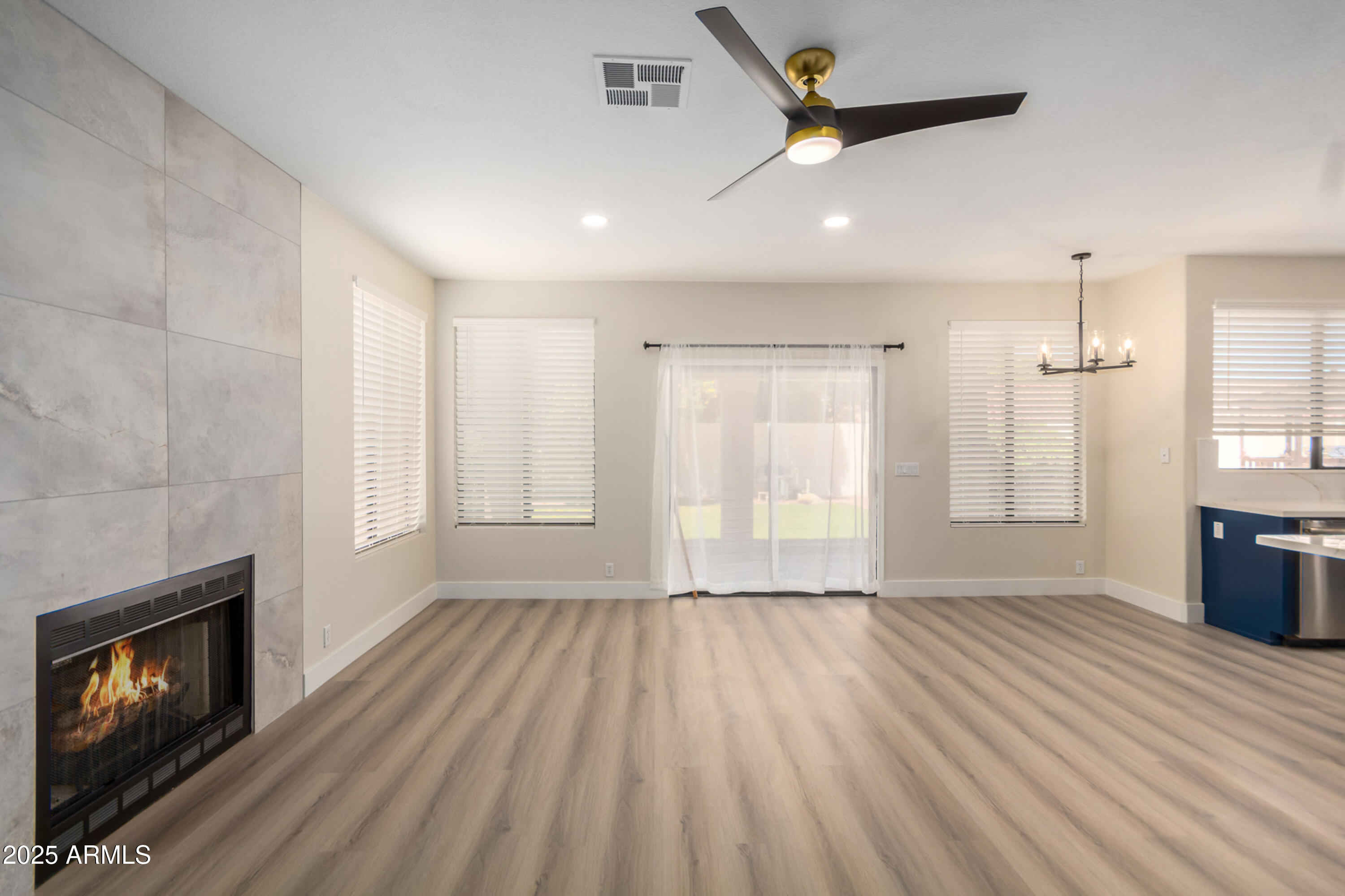 1630 South Lemon Mesa, AZ 85206 - Photo 23 of 55 a view of an empty room with a fireplace and a window