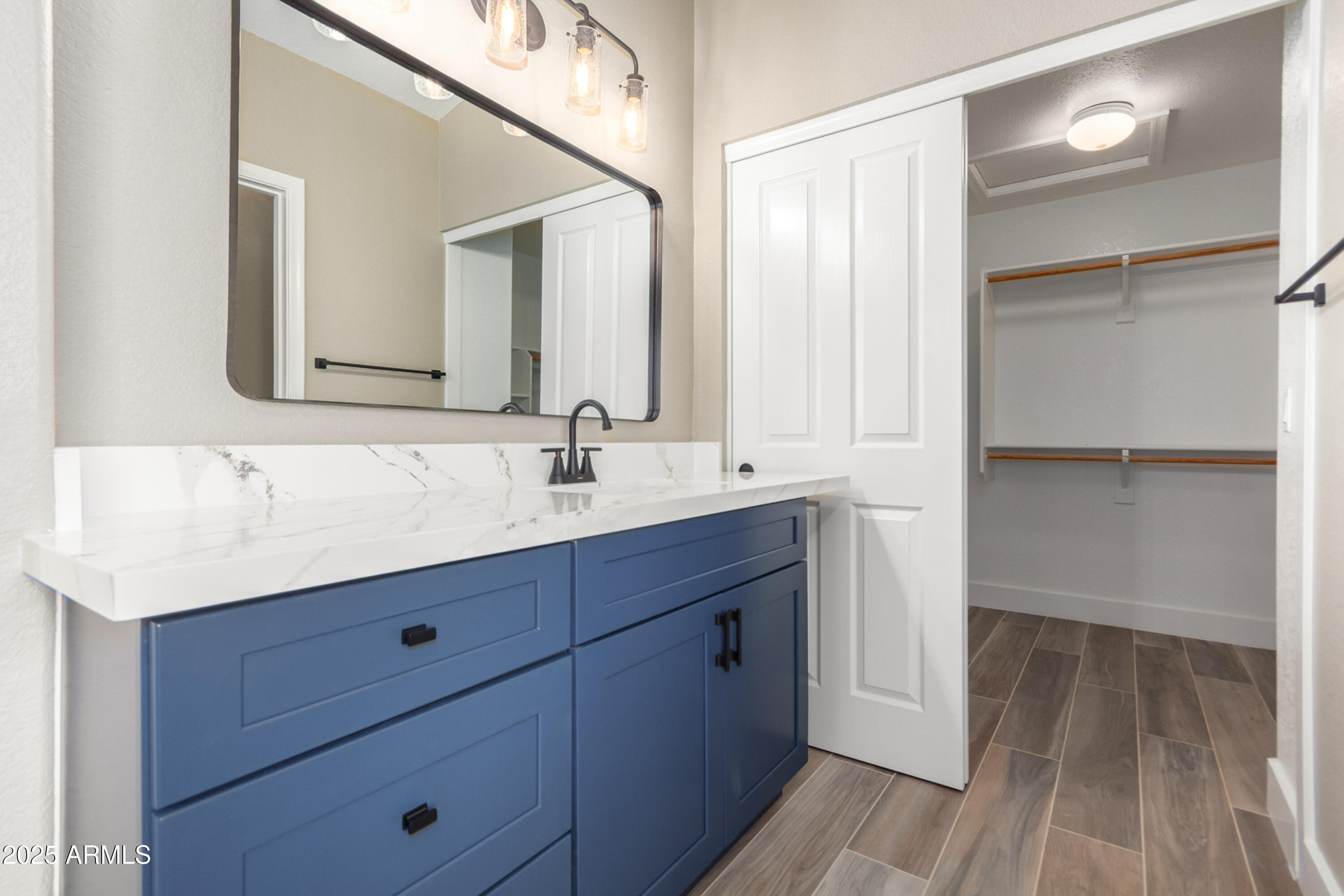 1630 South Lemon Mesa, AZ 85206 - Photo 30 of 55 a bathroom with a sink and a mirror