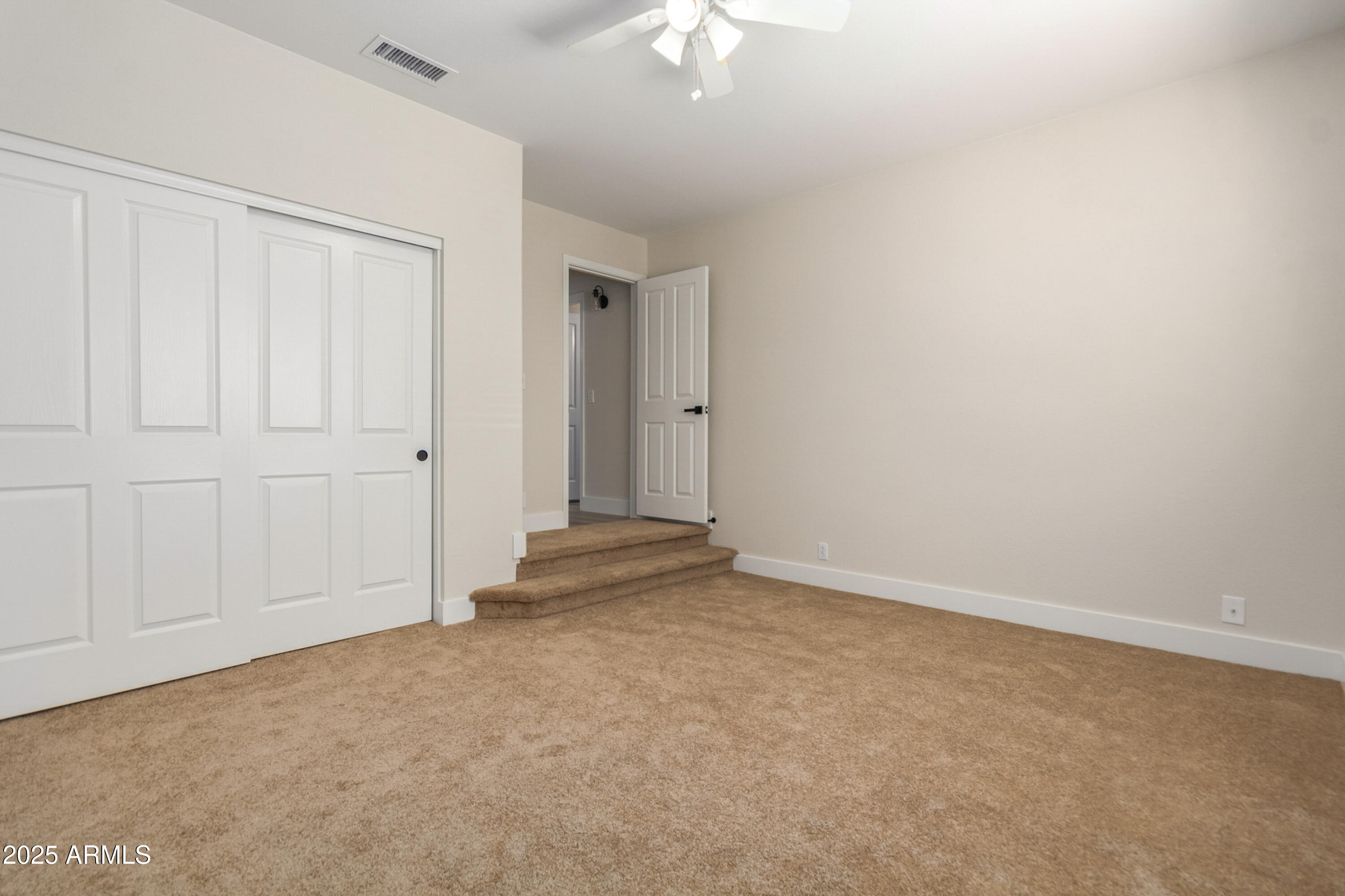 1630 South Lemon Mesa, AZ 85206 - Photo 37 of 55 an empty room with a ceiling fan