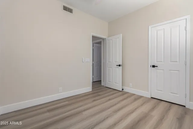 a view of a refrigerator and more cabinets