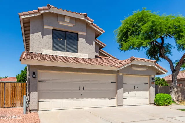 a front view of a house with a garage