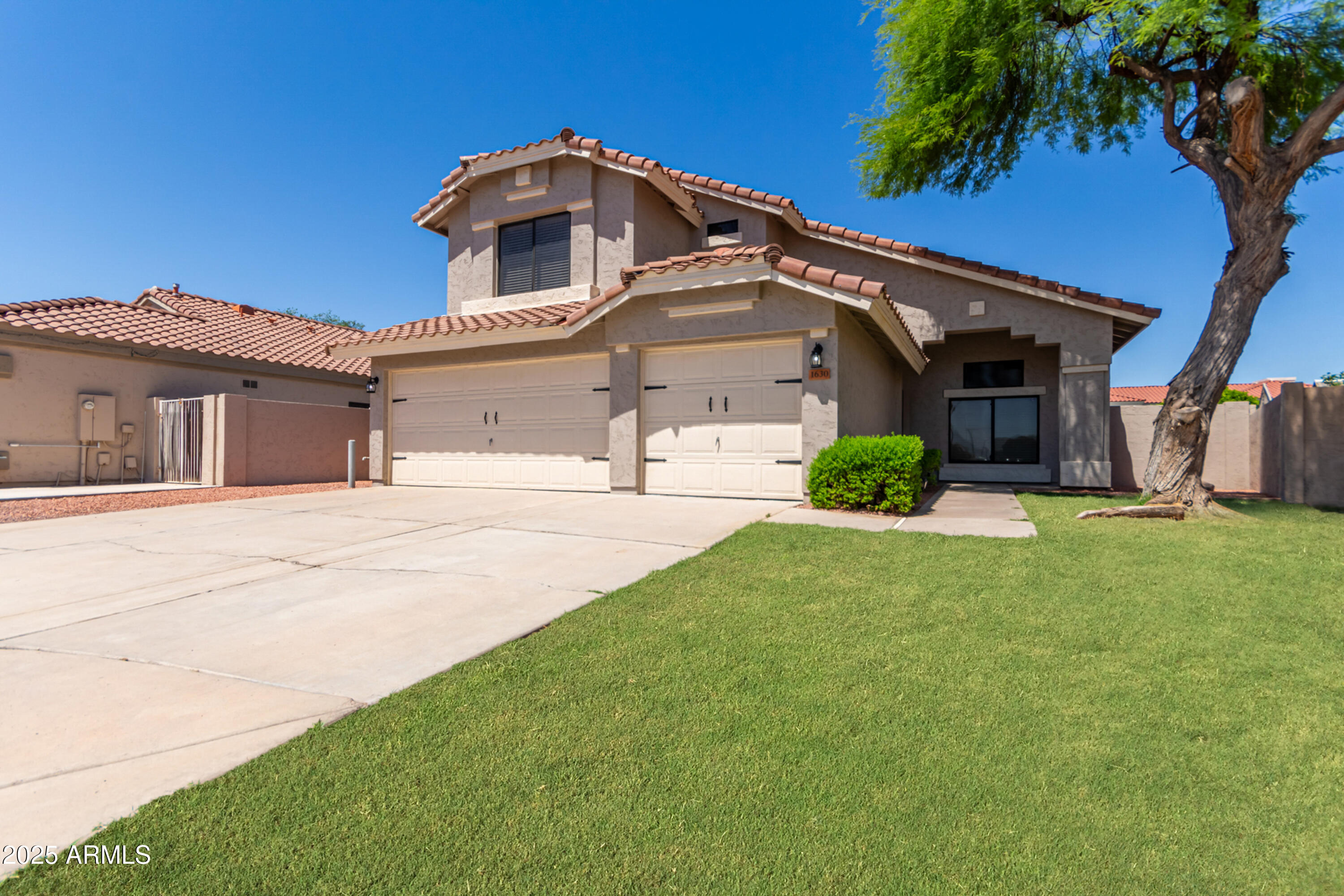 1630 South Lemon Mesa, AZ 85206 - Photo 10 of 55 a front view of a house with garden