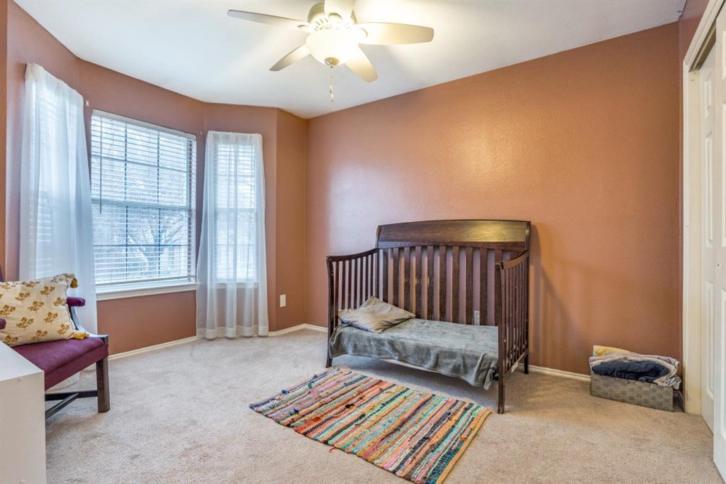 2031 Knights Court Allen, TX 75013 - Photo 7 of 12 a bedroom with a bed and a window
