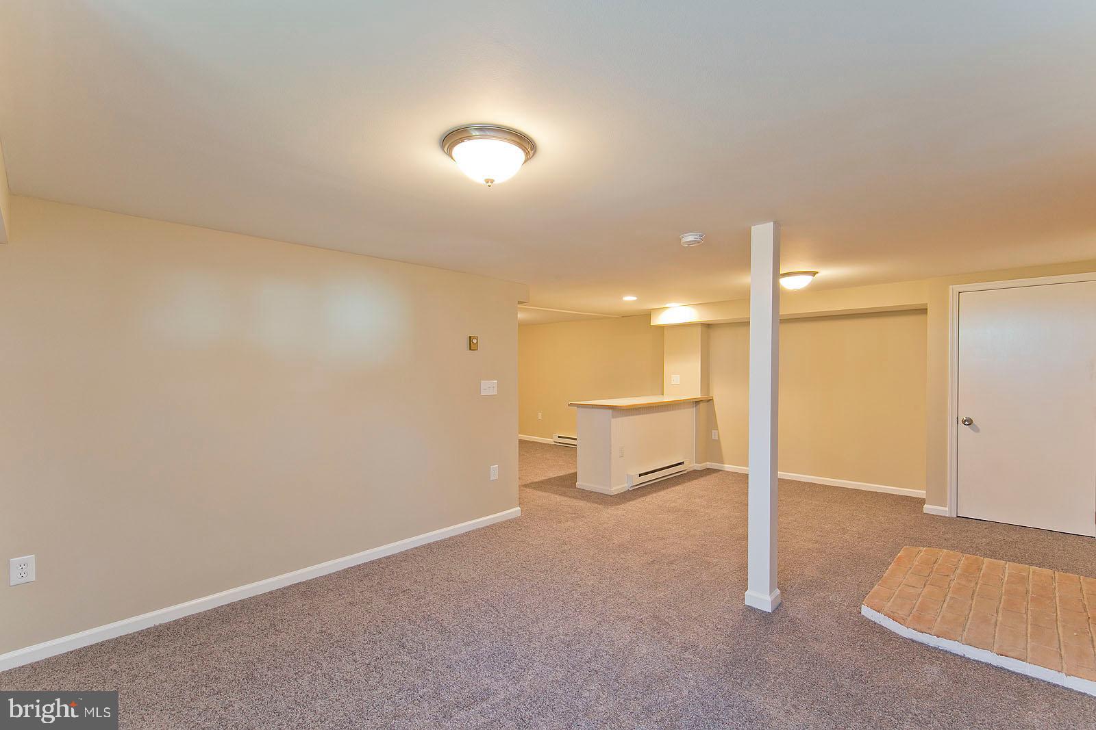 2110 Apple Pie Ridge Road Winchester, VA 22603 - Photo 33 of 48 Basement family room with bar