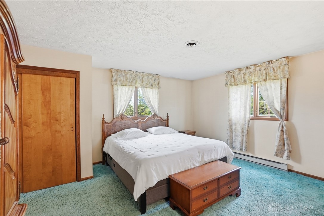 5669 O Neall Road Waynesville, OH 45068 - Photo 33 of 72 This spacious bedroom offers a tranquil retreat with ample natural light.