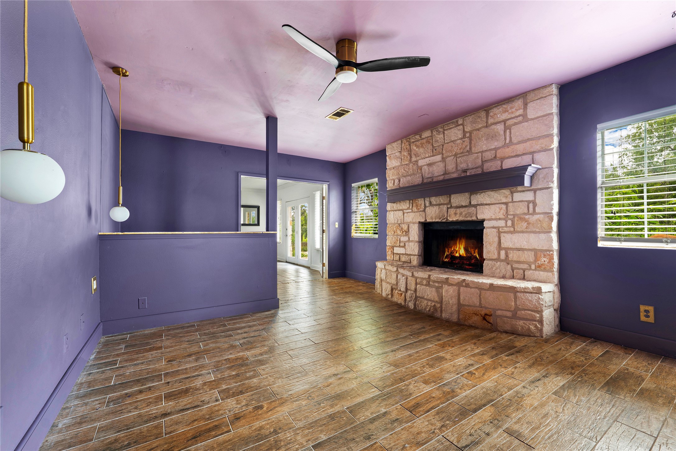 358 Easley Road Smithville, TX 78957 - Photo 15 of 36 Primary bedroom featuring a fireplace and ceiling fan