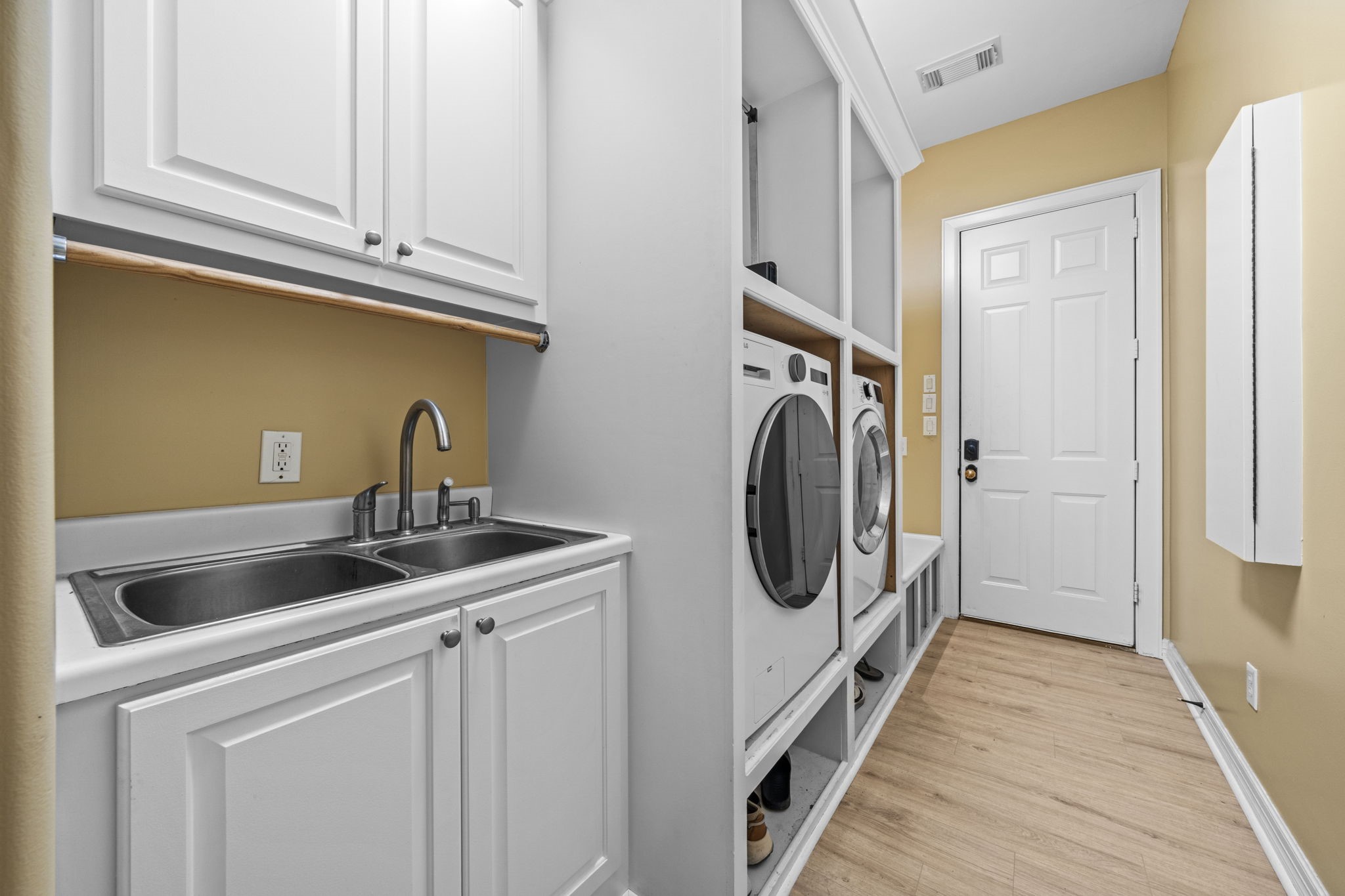 18732 Kz Road Cypress, TX 77433 - Photo 30 of 49 A masterclass in organization! This combined laundry and mudroom features a dedicated sink and cabinetry, ensuring everything has its own perfect place.