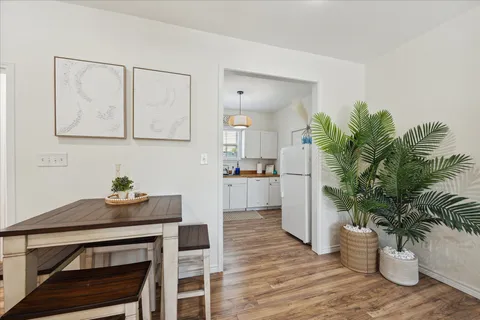 a kitchen with cabinets appliances a sink and a counter space