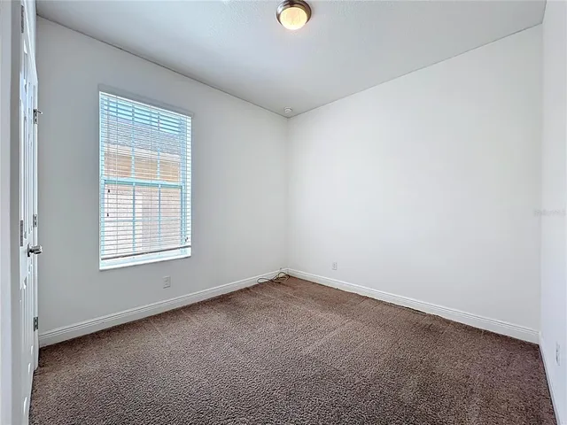 a view of livingroom with furniture and window