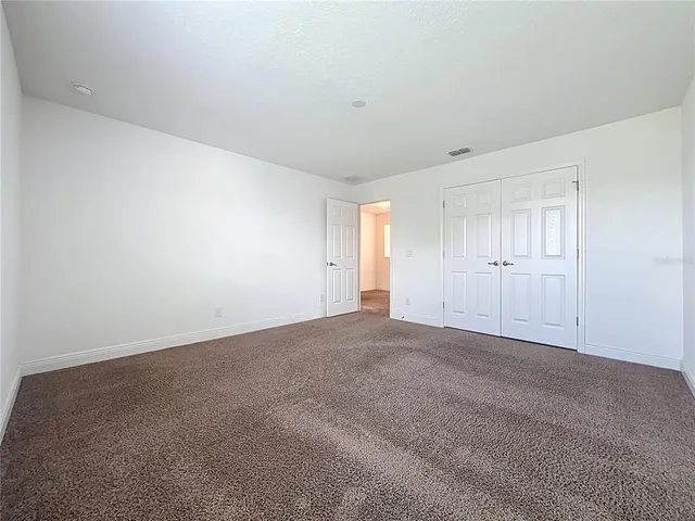 a bathroom with a granite countertop sink mirror and a bathtub