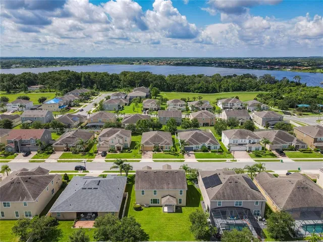 an aerial view of residential houses with outdoor space