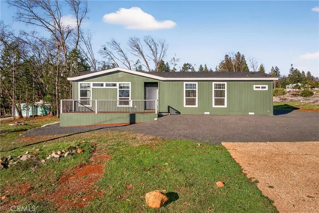 a front view of a house with yard