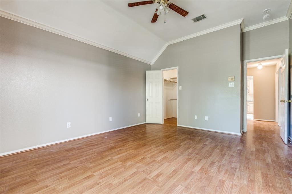4232 Briarbend Road Dallas, TX 75287 - Photo 11 of 20 a view of an empty room with wooden floor