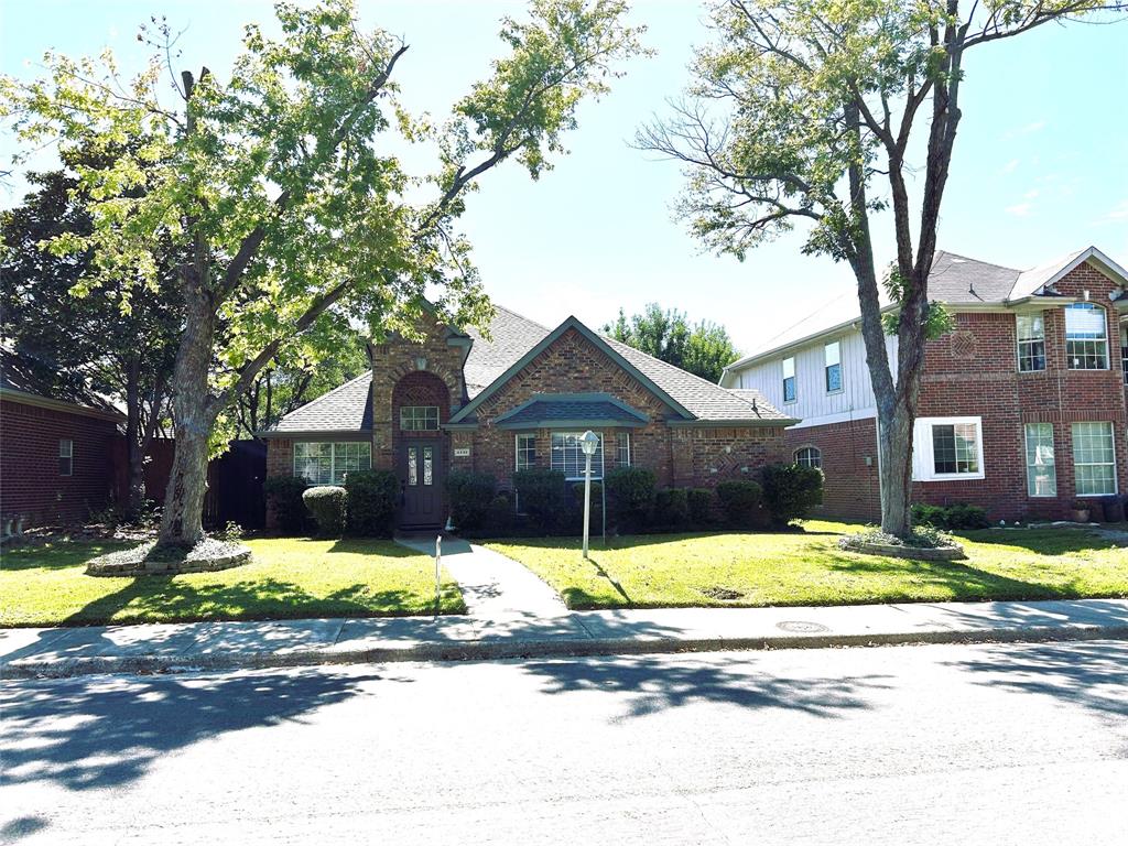 4232 Briarbend Road Dallas, TX 75287 - Photo 16 of 20 a view of a house with a yard in front of it