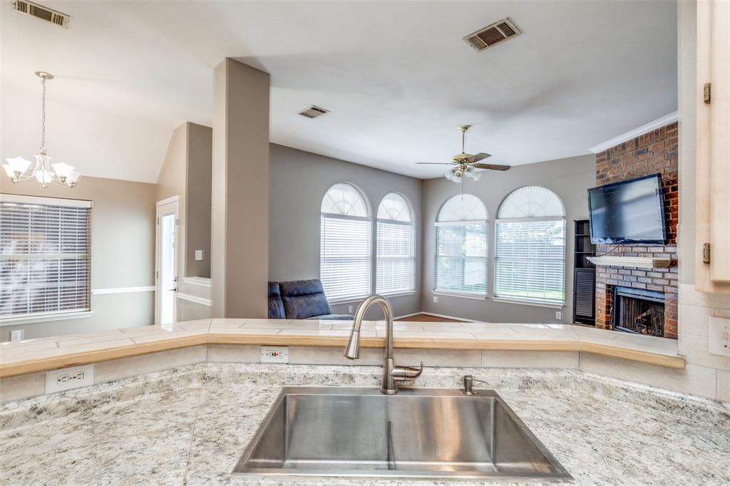 4232 Briarbend Road Dallas, TX 75287 - Photo 5 of 20 a view of kitchen with sink refrigerator and microwave