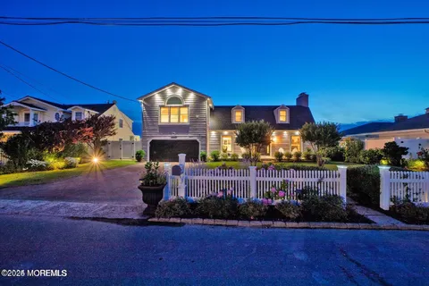 a room with lots of wooden furniture and a table