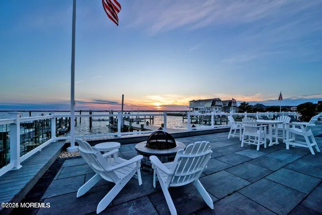 a kitchen with granite countertop white cabinets and stainless steel appliances