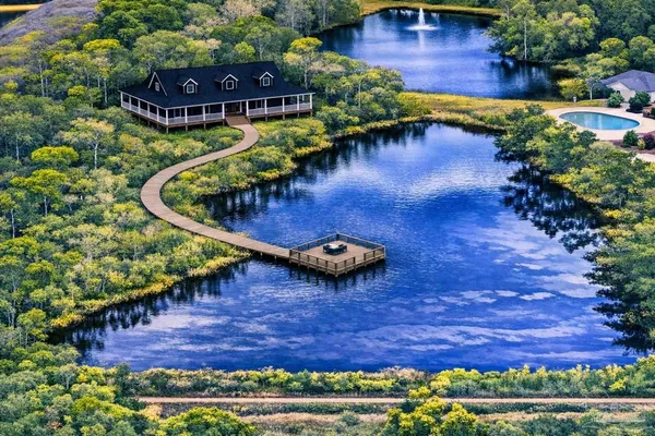 a view of a swimming pool with a patio