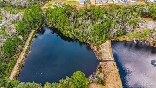 a view of a lake with a yard