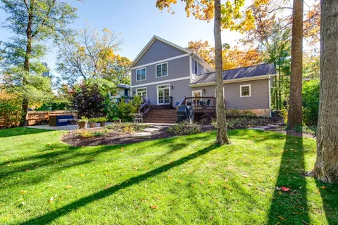 a house view with a sitting space and garden