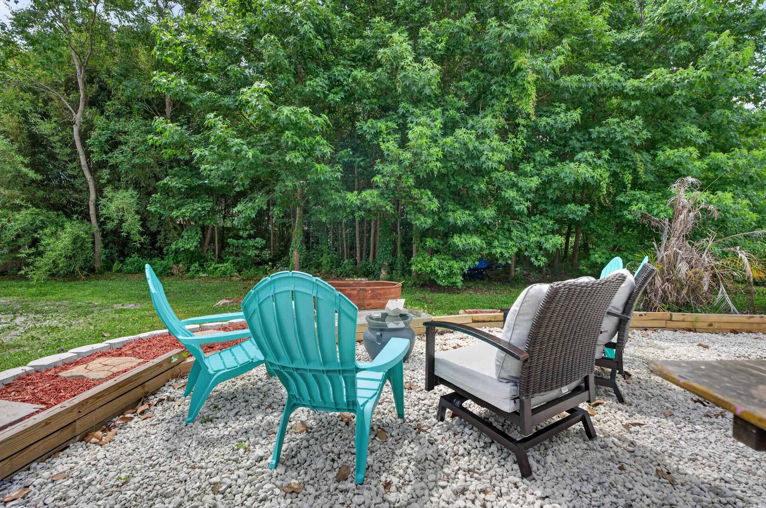 111 Pompano Road St. Augustine, FL 32086 - Photo 38 of 61 a view of a table and chairs in the garden