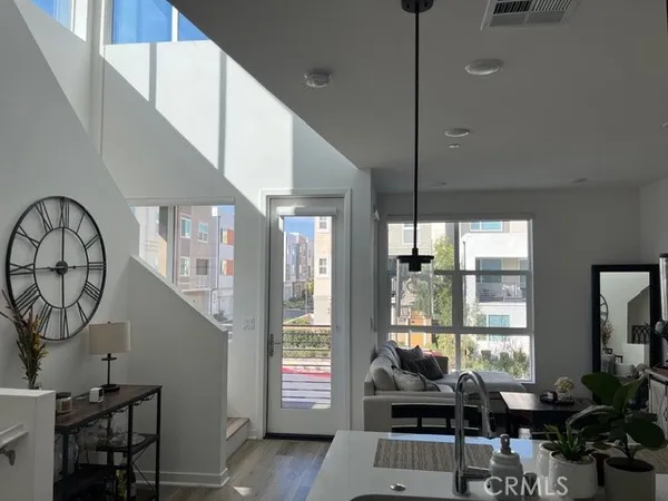 a view of livingroom with furniture wooden floor and windows
