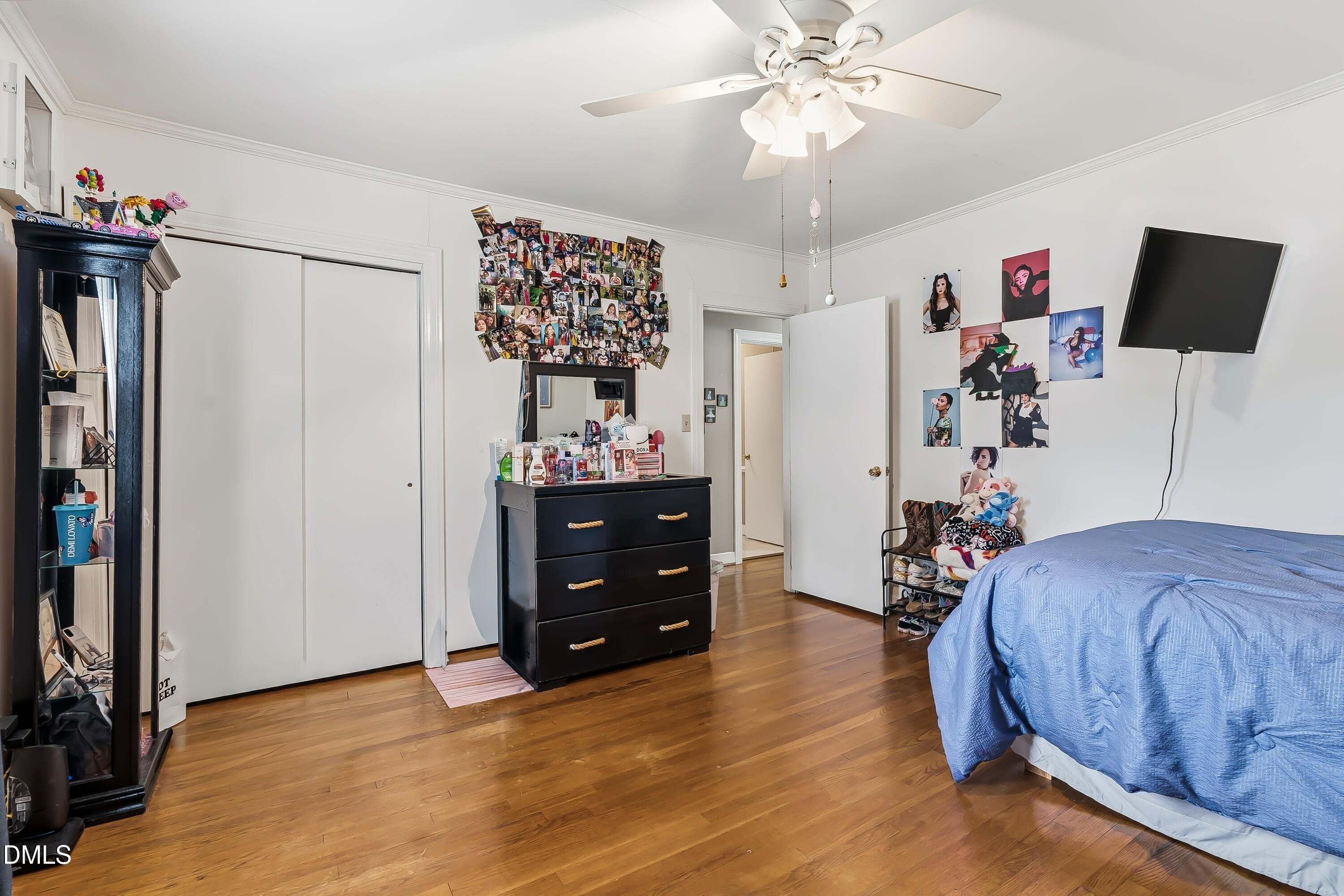 4967 Highway 581 Spring Hope, NC 27882 - Photo 31 of 44 a bedroom with a bed and a chandelier