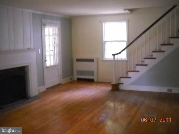 5802 Kenmore Road Baltimore, MD 21210 - Photo 3 of 5 a view of entryway and hall with wooden floor