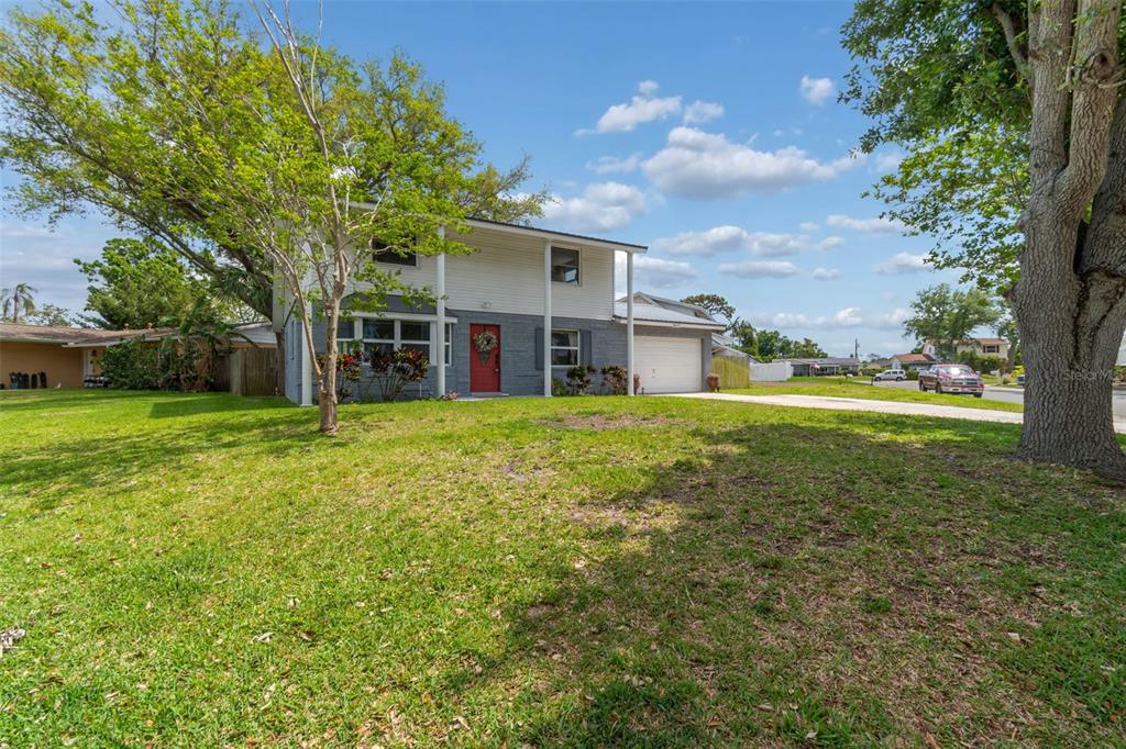 8043 124th Street North Seminole, FL 33772 - Photo 2 of 68 a view of a house with a yard